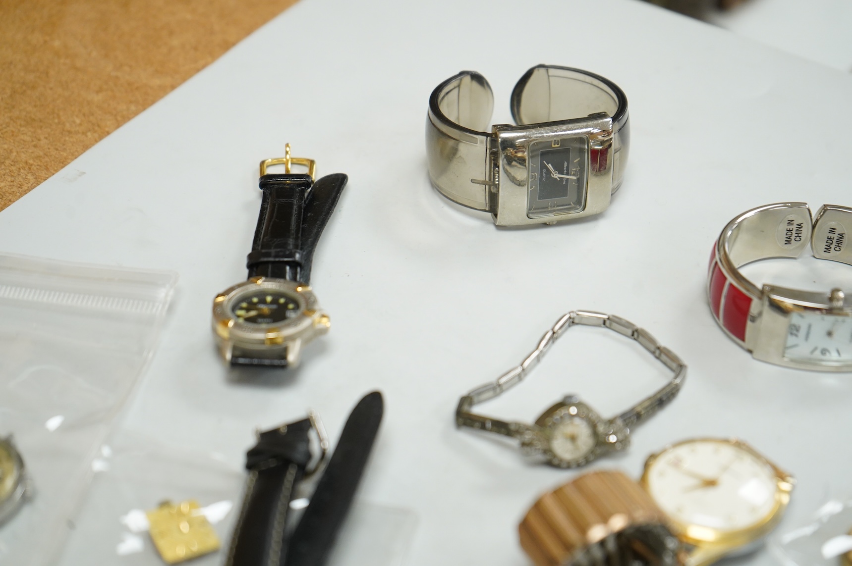 A small collection of assorted lady's and gentleman's wrist watches, including three Omega De Ville steel and gold plated quartz watches and wrist watches movements including Girard Perregaux.
